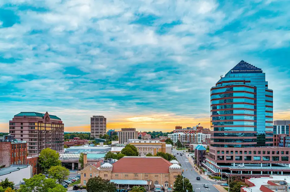 The downtown Durham skyline during an heavily clouded sunset. Durham Centre, the