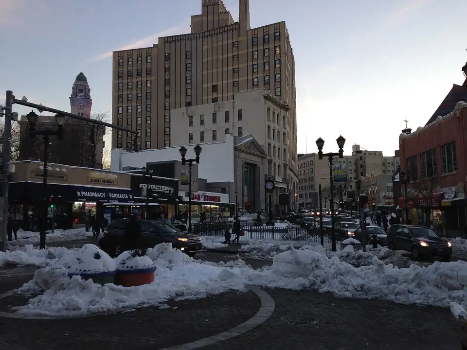 Yonkers City Hall tower to left, tan colored 20 South Broadway in center. Lookin